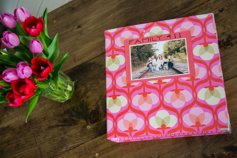 Grab of colorful binder so it’s easy to spot in a drawer or on a shelf, then customize it with a family photo and colorful card stock.